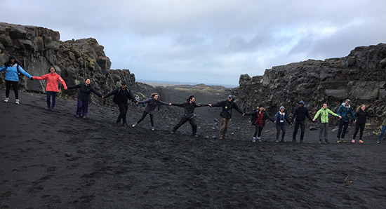 The high school students clasp hands with York U students to traverse the North American and Eurasia tectonic plates
